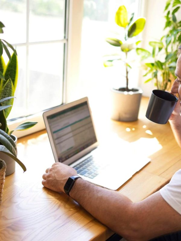 young-personal-development-coach-answering-the-client-by-email-by-a-laptop-1.jpg